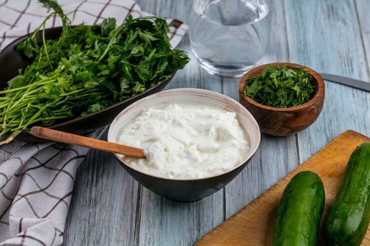front-view-cucumbers-board-with-yogurt-greens-gray-surface_141793-17671 (1)